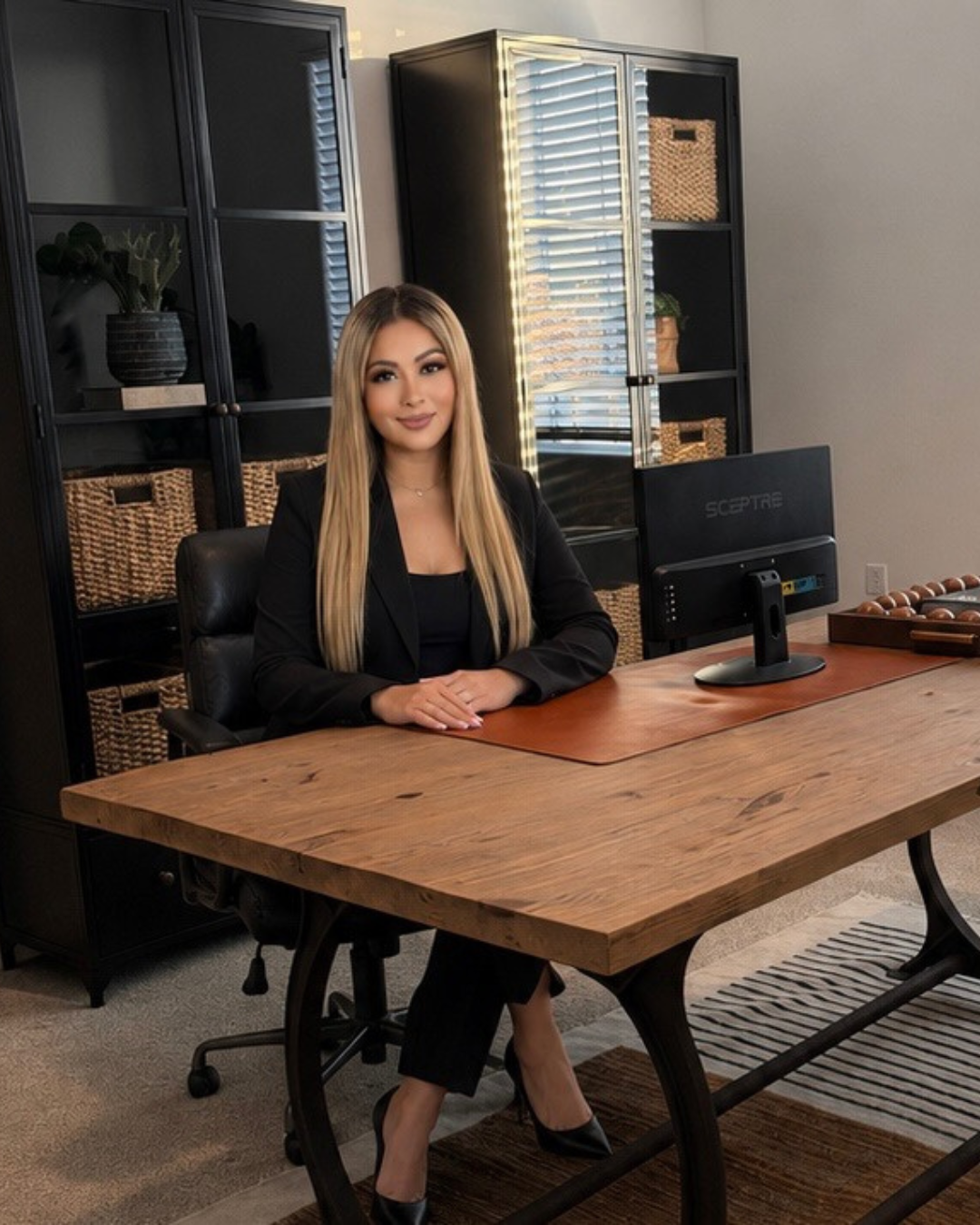 Taty Recinos, Bakersfield CA Realtor, at her office ready to help clients buy, sell, and invest