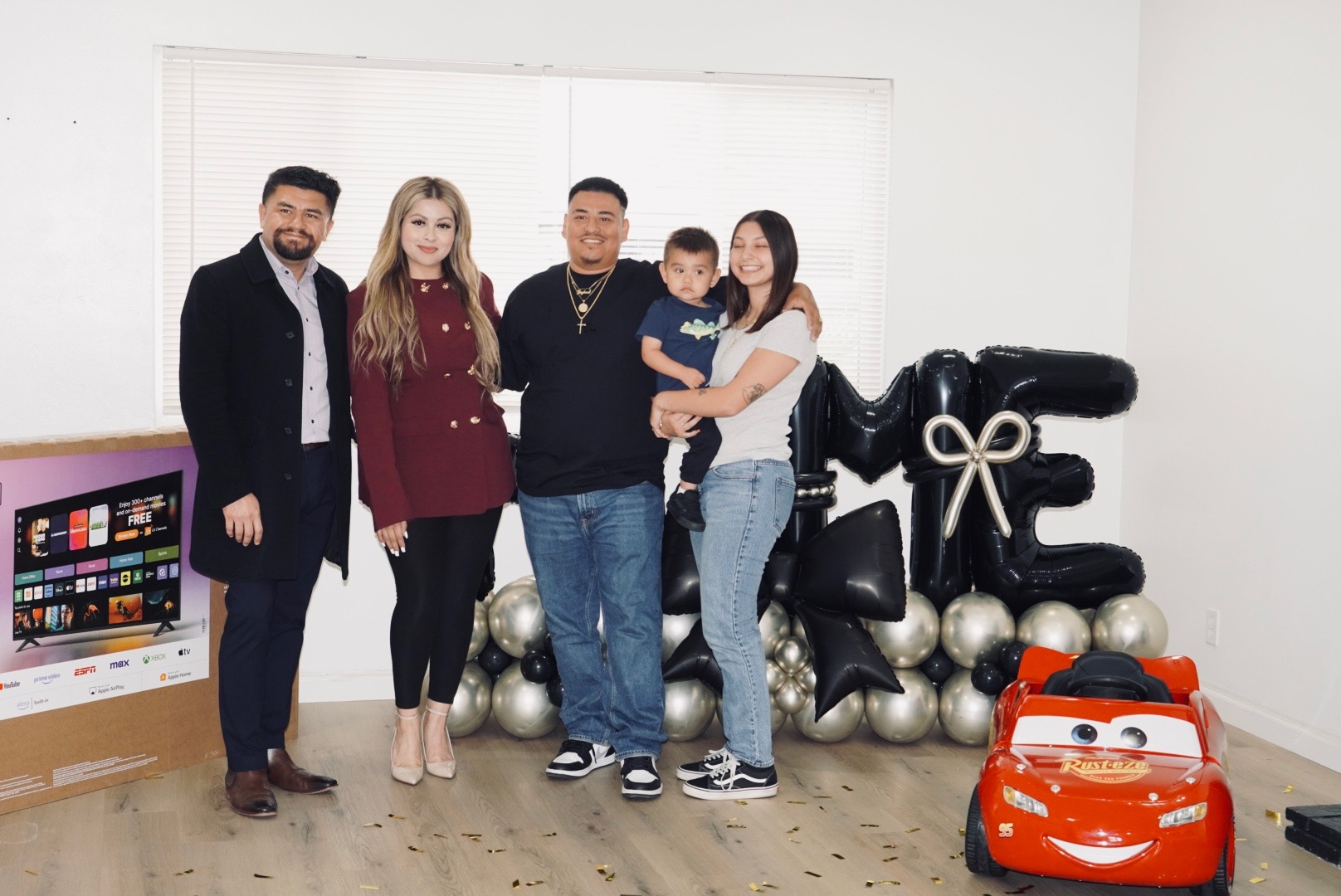 Happy family at their new home closing celebration in Bakersfield
