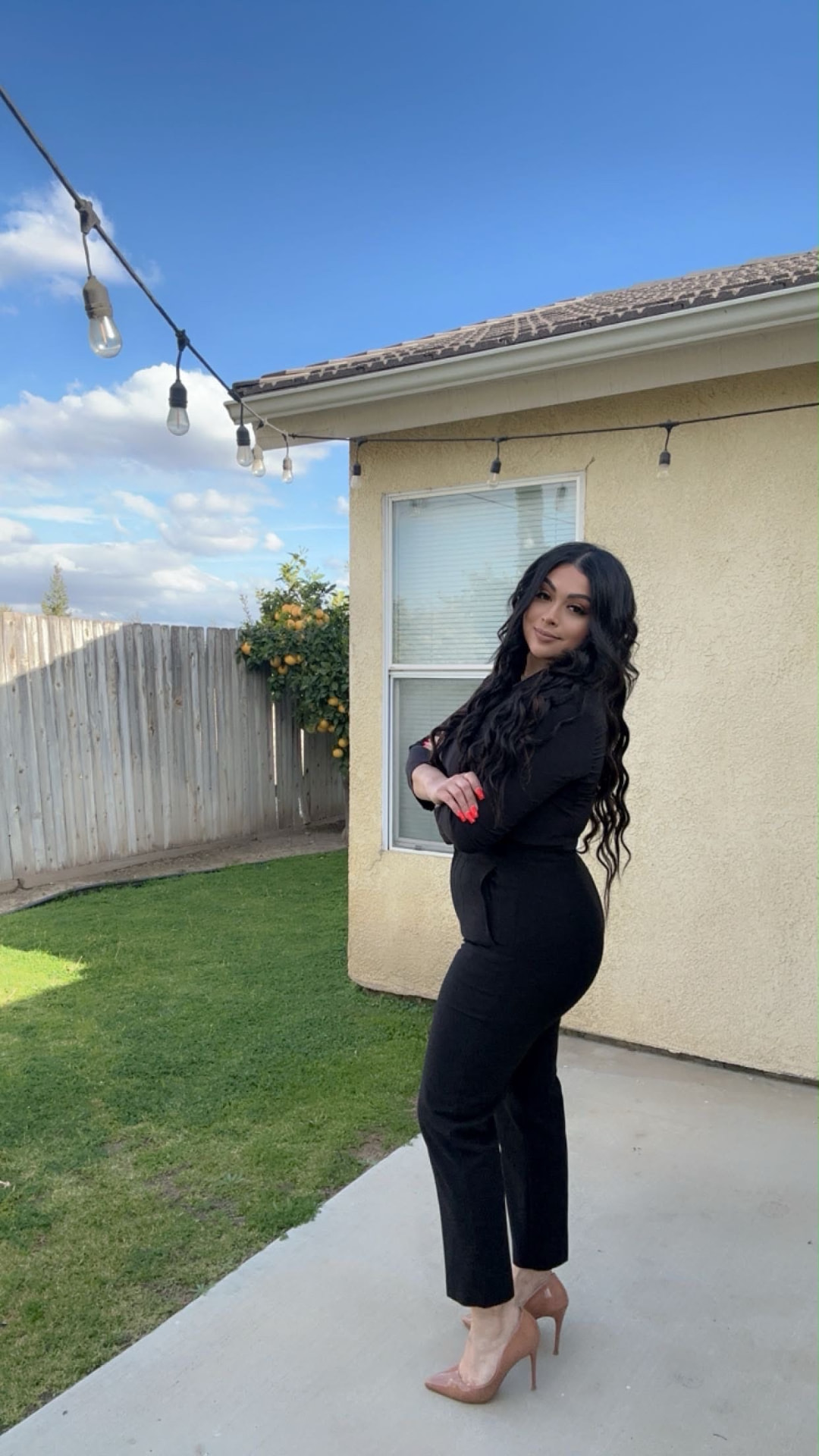 Taty Recinos in the backyard of a Kern County listing